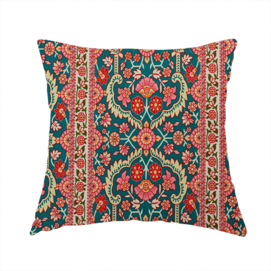 The fabric used to create this handmade cushion features a vertical striped pattern filled with ornate floral and botanical motifs, set against a rich teal background. The intricate design includes scrolling vines and blossoms in shades of pink, red, and cream.