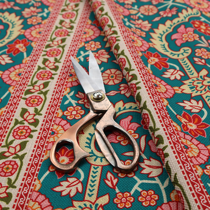 The image features a vertical striped pattern filled with ornate floral and botanical motifs, set against a rich teal background. The intricate design includes scrolling vines and blossoms in shades of pink, red, and cream.