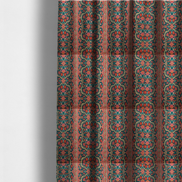 The fabric used to create these made-to-measure curtains features a vertical striped pattern filled with ornate floral and botanical motifs, set against a rich teal background. The intricate design includes scrolling vines and blossoms in shades of pink, red, and cream.