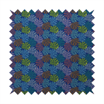 The image features an intricate, dense repeating pattern of sea coral or moss-like clusters set against a deep blue background. The design is filled with detailed organic shapes rendered in various vibrant colours, including lime green, rust orange, teal, and soft pink.