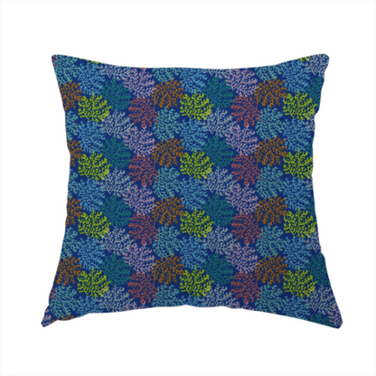 The fabric used to create this handmade cushion features an intricate, dense repeating pattern of sea coral or moss-like clusters set against a deep blue background. The design is filled with detailed organic shapes rendered in various vibrant colours, including lime green, rust orange, teal, and soft pink