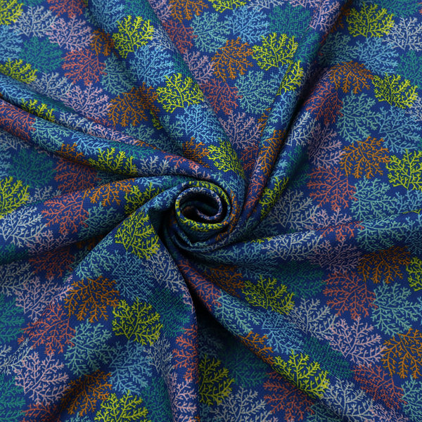 The image features an intricate, dense repeating pattern of sea coral or moss-like clusters set against a deep blue background. The design is filled with detailed organic shapes rendered in various vibrant colours, including lime green, rust orange, teal, and soft pink.