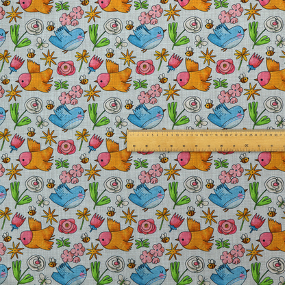 The image features a playful, repeating pattern of whimsical birds, flowers, and bees set against a light background. The whimsical design includes blue and orange-yellow birds, pink and white flowers, and tiny buzzing bees.