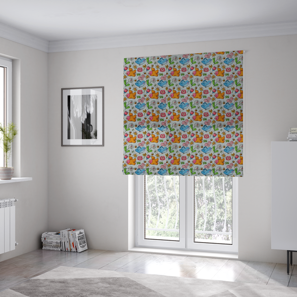 The fabric used to create these Roman blinds features a playful, repeating pattern of whimsical birds, flowers, and bees set against a light background. The whimsical design includes blue and orange-yellow birds, pink and white flowers, and tiny buzzing bees.