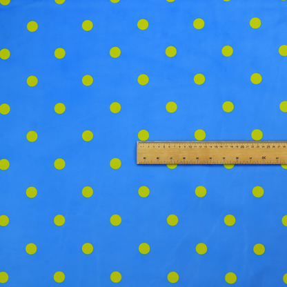 A blue fabric pattern featuring evenly spaced yellow polka dots arranged in horizontal and vertical rows.