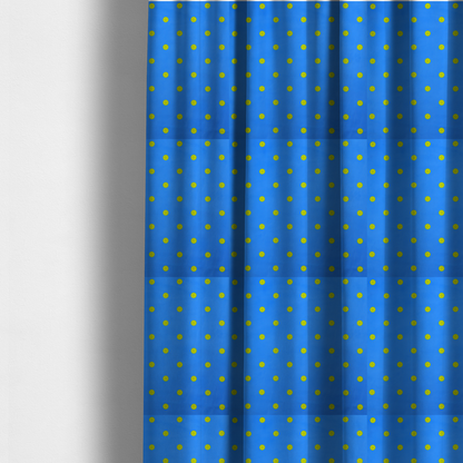 The fabric used to create these made-to-measure curtains is a blue fabric pattern featuring evenly spaced yellow polka dots arranged in horizontal and vertical rows.