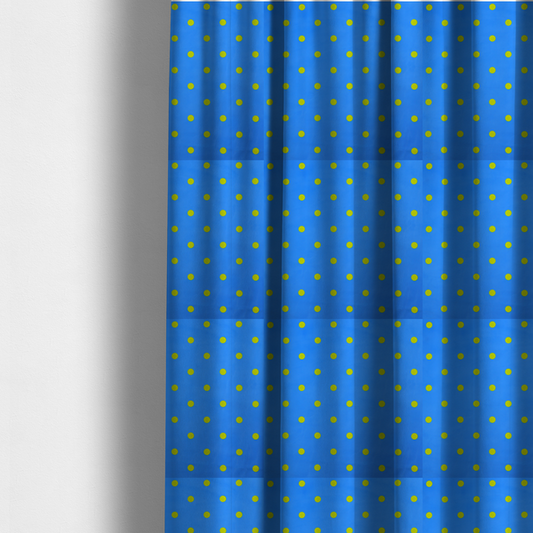 The fabric used to create these made-to-measure curtains is a blue fabric pattern featuring evenly spaced yellow polka dots arranged in horizontal and vertical rows.