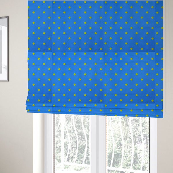 The fabric used to create these Roman blinds is a blue fabric pattern featuring evenly spaced yellow polka dots arranged in horizontal and vertical rows.