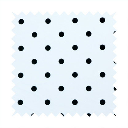 A white fabric pattern featuring evenly spaced black polka dots arranged in horizontal and vertical rows.