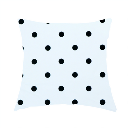 The fabric used to create this handmade cushion is a white fabric pattern featuring evenly spaced black polka dots arranged in horizontal and vertical rows.