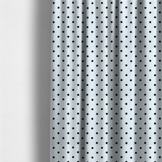 The fabric used to create these made-to-measure curtains is a white fabric pattern featuring evenly spaced black polka dots arranged in horizontal and vertical rows.