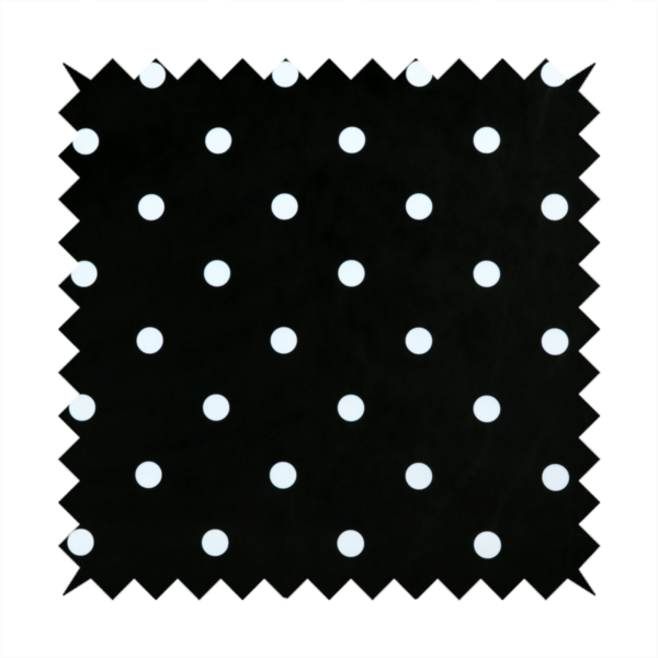 A black fabric pattern featuring evenly spaced white polka dots arranged in horizontal and vertical rows.