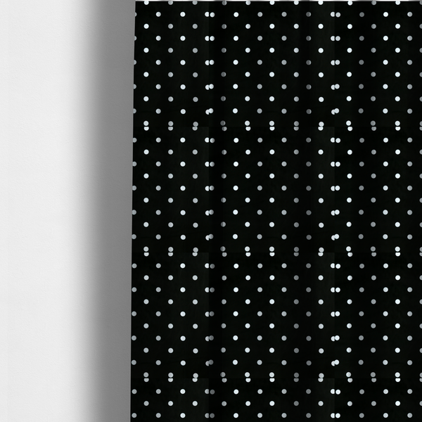 The fabric used to create these made-to-measure curtains is a black fabric pattern featuring evenly spaced white polka dots arranged in horizontal and vertical rows.