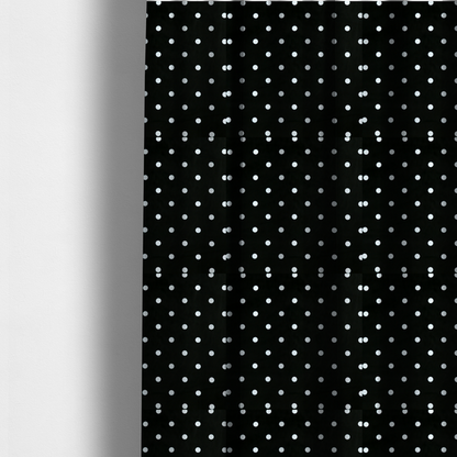 The fabric used to create these made-to-measure curtains is a black fabric pattern featuring evenly spaced white polka dots arranged in horizontal and vertical rows.