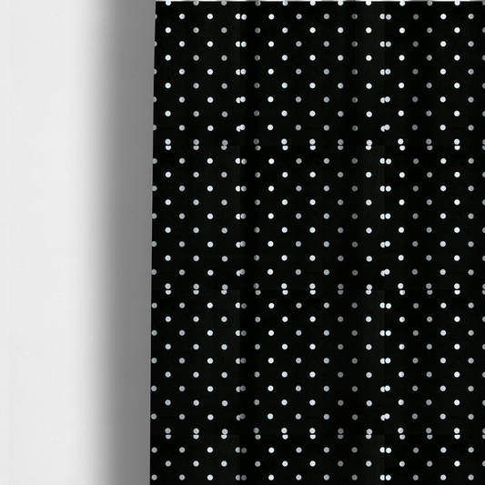 The fabric used to create these made-to-measure curtains is a black fabric pattern featuring evenly spaced white polka dots arranged in horizontal and vertical rows.