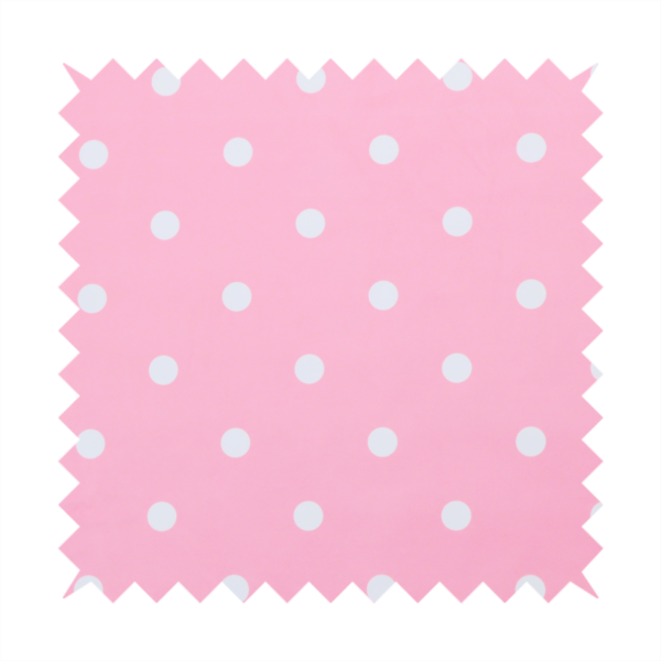 A pink fabric pattern featuring evenly spaced white polka dots arranged in horizontal and vertical rows.