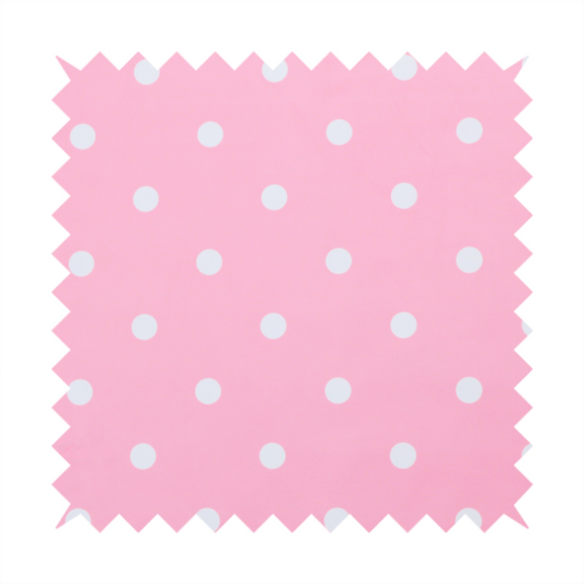 A pink fabric pattern featuring evenly spaced white polka dots arranged in horizontal and vertical rows.