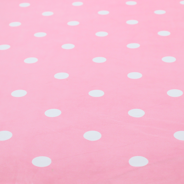 A pink fabric pattern featuring evenly spaced white polka dots arranged in horizontal and vertical rows.
