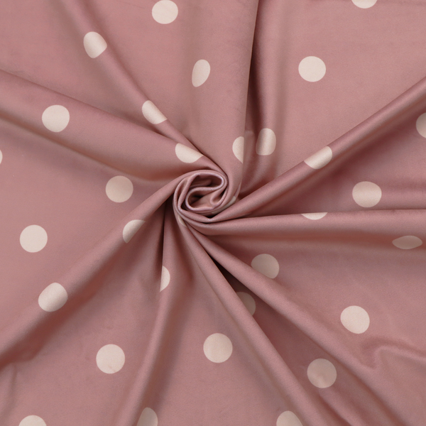 A dusty rose or mauve fabric pattern featuring evenly spaced off-white polka dots arranged in horizontal and vertical rows.