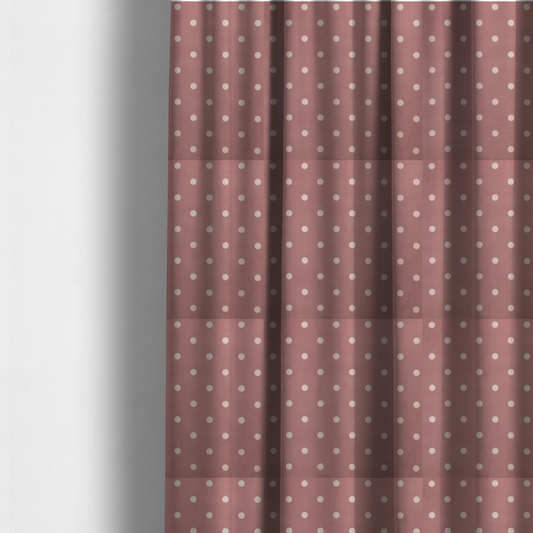 The fabric used to create these made-to-measure curtains is a dusty rose or mauve fabric pattern featuring evenly spaced off-white polka dots arranged in horizontal and vertical rows.