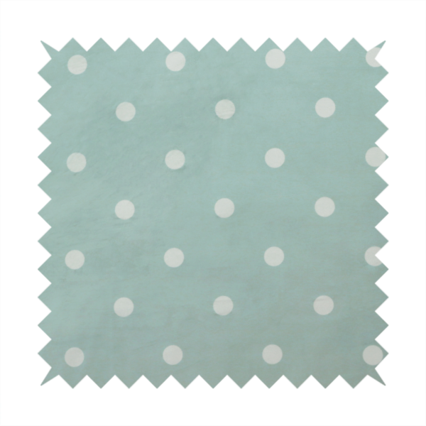A sage green or pale teal fabric pattern featuring evenly spaced white polka dots arranged in horizontal and vertical rows.