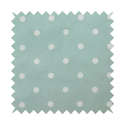 A sage green or pale teal fabric pattern featuring evenly spaced white polka dots arranged in horizontal and vertical rows.