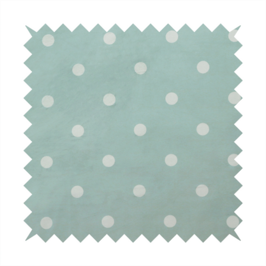 A sage green or pale teal fabric pattern featuring evenly spaced white polka dots arranged in horizontal and vertical rows.