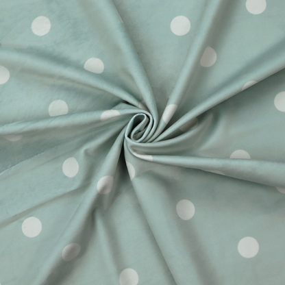 A sage green or pale teal fabric pattern featuring evenly spaced white polka dots arranged in horizontal and vertical rows.