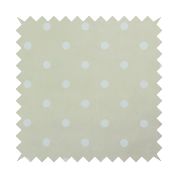A cream or beige fabric pattern featuring evenly spaced white polka dots arranged in horizontal and vertical rows.