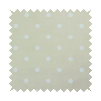 A cream or beige fabric pattern featuring evenly spaced white polka dots arranged in horizontal and vertical rows.