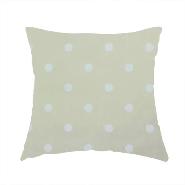 The fabric used to create this handmade cushion is cream or beige fabric pattern featuring evenly spaced white polka dots arranged in horizontal and vertical rows.