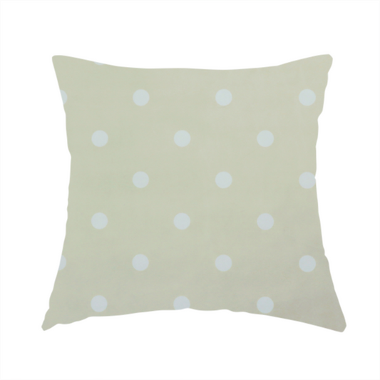 The fabric used to create this handmade cushion is cream or beige fabric pattern featuring evenly spaced white polka dots arranged in horizontal and vertical rows.