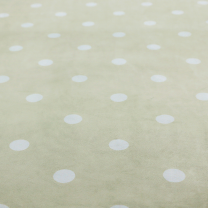 A cream or beige fabric pattern featuring evenly spaced white polka dots arranged in horizontal and vertical rows.