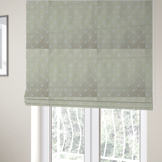 The fabric used to create these Roman blinds is a cream or beige fabric pattern featuring evenly spaced white polka dots arranged in horizontal and vertical rows.