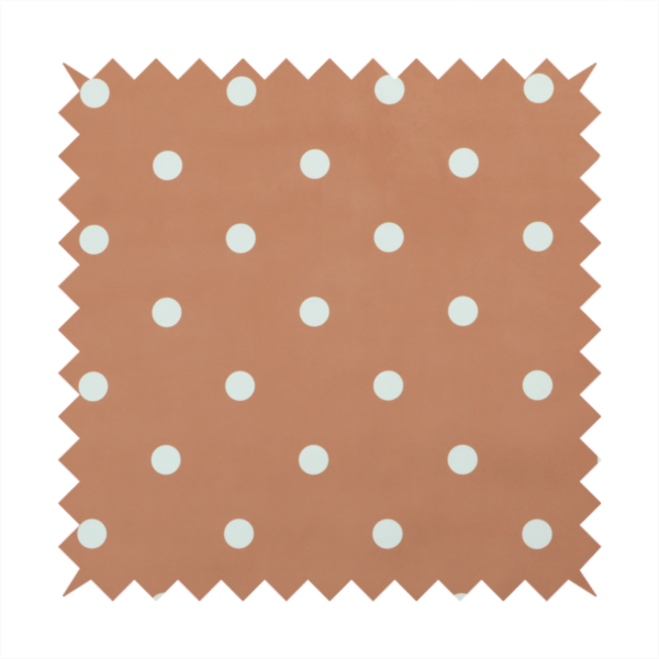 A terracotta or warm brown fabric pattern featuring evenly spaced white polka dots arranged in horizontal and vertical rows.