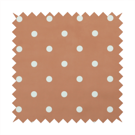A terracotta or warm brown fabric pattern featuring evenly spaced white polka dots arranged in horizontal and vertical rows.