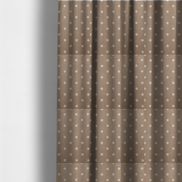 The fabric used to create these made-to-measure curtains is a taupe or warm grey-brown fabric pattern featuring evenly spaced white polka dots arranged in horizontal and vertical rows.