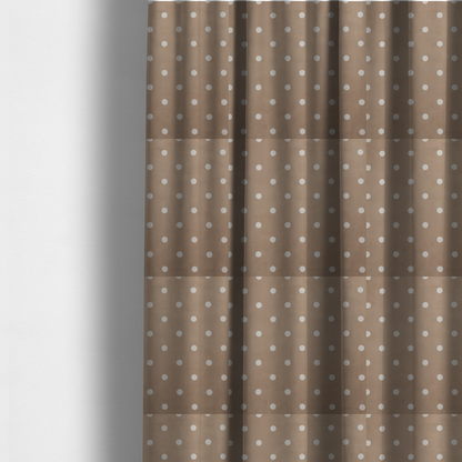 The fabric used to create these made-to-measure curtains is a taupe or warm grey-brown fabric pattern featuring evenly spaced white polka dots arranged in horizontal and vertical rows.