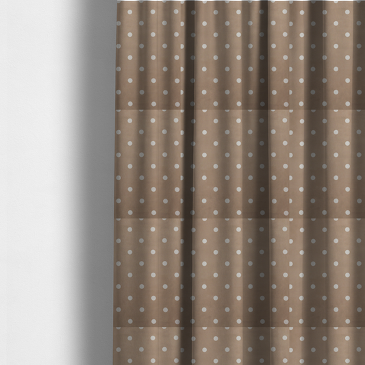 The fabric used to create these made-to-measure curtains is a taupe or warm grey-brown fabric pattern featuring evenly spaced white polka dots arranged in horizontal and vertical rows.