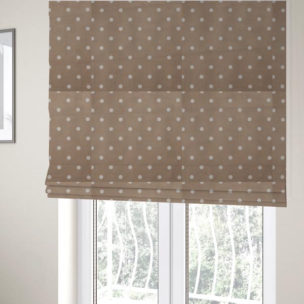 The fabric used to create these Roman blinds is a taupe or warm grey-brown fabric pattern featuring evenly spaced white polka dots arranged in horizontal and vertical rows.