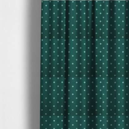 The fabric used to create these made-to-measure curtains is a dark teal or blue-green fabric pattern featuring evenly spaced pale green or off-white polka dots arranged in horizontal and vertical rows.