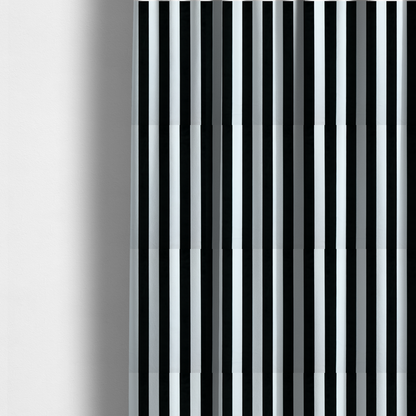 The fabric used to create these made-to-measure curtains is a vertically striped fabric pattern featuring alternating bands of black and white.