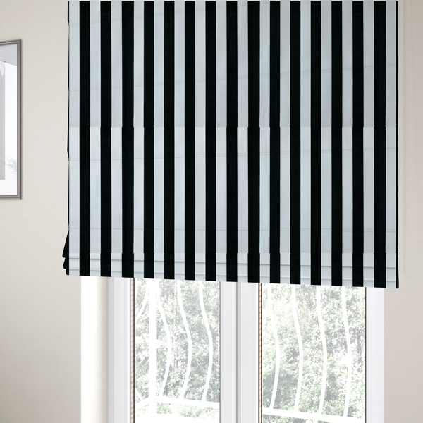 The fabric used to create these Roman blinds is a vertically striped fabric pattern featuring alternating bands of black and white.