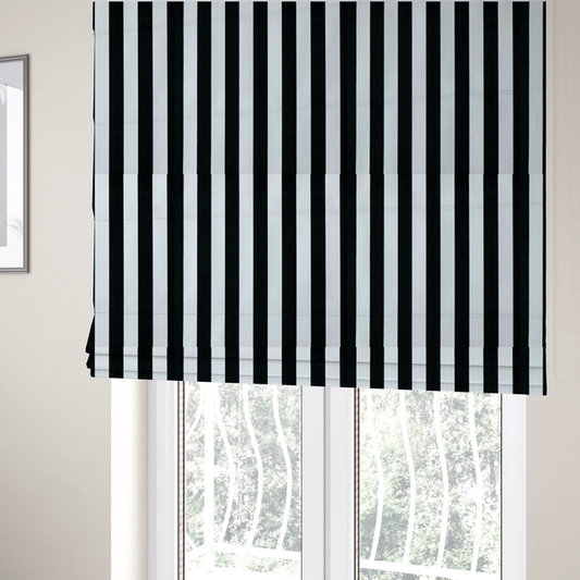 The fabric used to create these Roman blinds is a vertically striped fabric pattern featuring alternating bands of black and white.