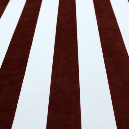 A vertically striped fabric pattern featuring alternating bands of dark brown and white.