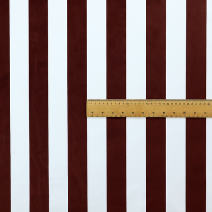 A vertically striped fabric pattern featuring alternating bands of dark brown and white.