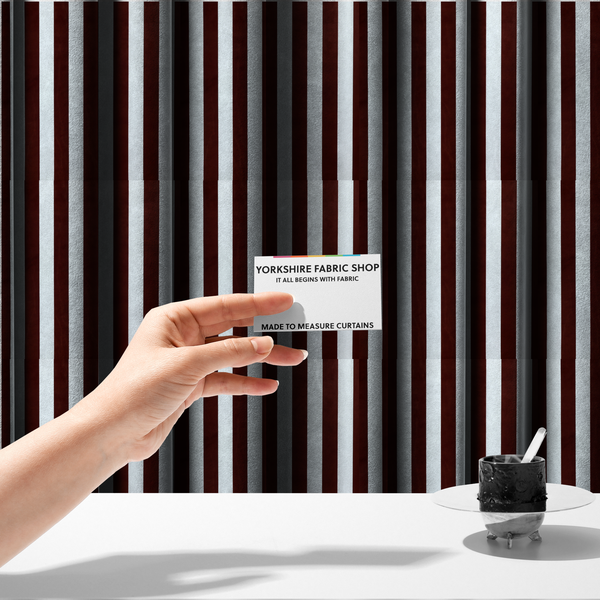 The fabric used to create these made-to-measure curtains is a vertically striped fabric pattern featuring alternating bands of dark brown and white.