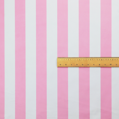 A vertically striped fabric pattern featuring alternating bands of pink and white.