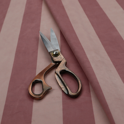 A vertically striped fabric pattern featuring alternating bands of dark dusty rose or mauve and a lighter tone.