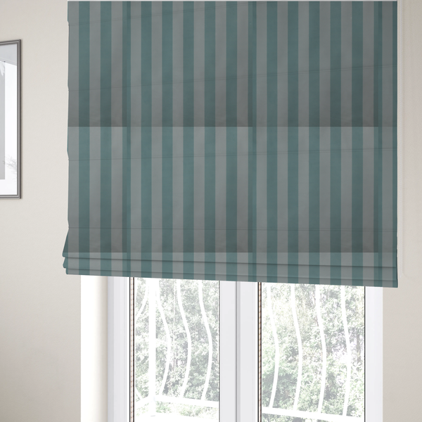 The fabric used to create these Roman blinds is a vertically striped fabric pattern featuring alternating bands of soft blue-green or teal and white.